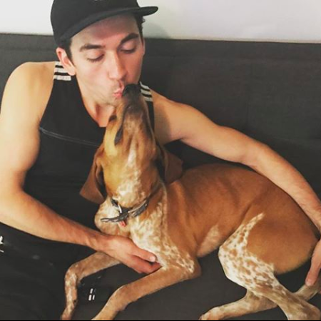 Adam Berry with His Dog Redman
